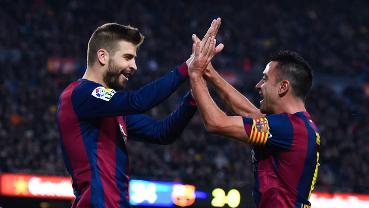 Pique dan Xavi saat bermain bersama di Barcelona